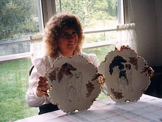 Francie Stull with the plates that are the first known art of Silken Windhounds